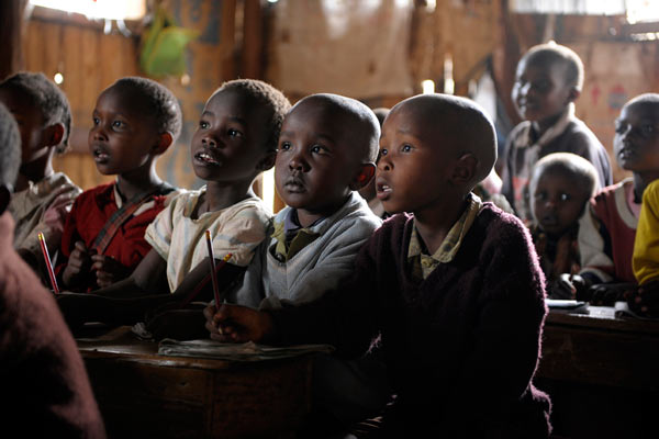 young Kenyan children in crowded primary school by Janie Airey photographer
