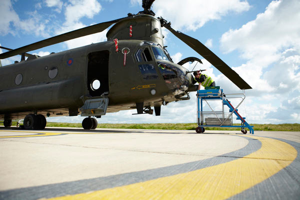 engineer working on Chinook helicopter by Janie Airey photographer